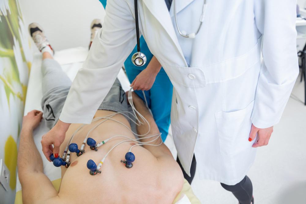 Clinician placing electrodes on a patient's chest